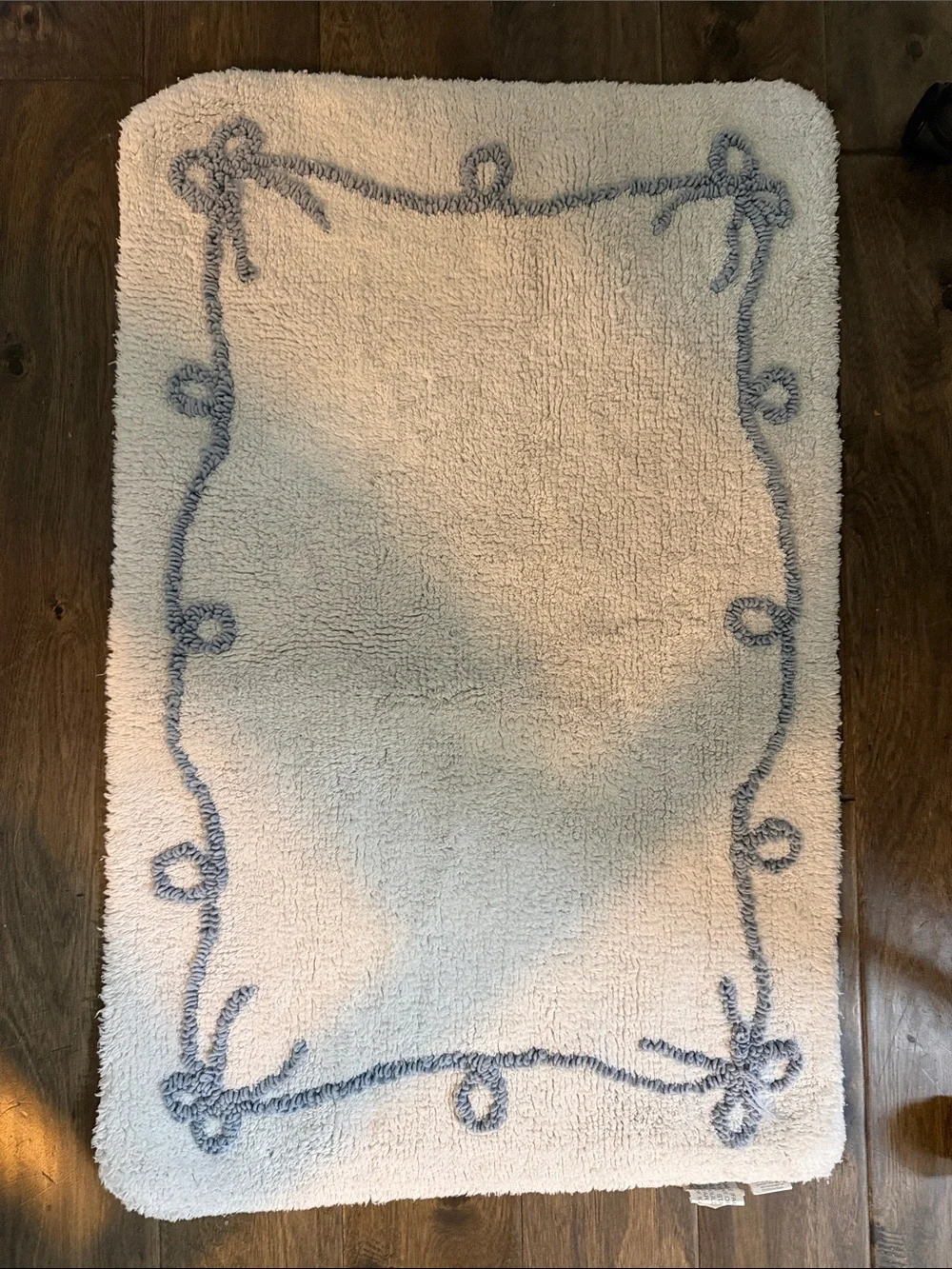 White Shower Curtain with Blue Bow Line Pattern includes 2 matching rugs